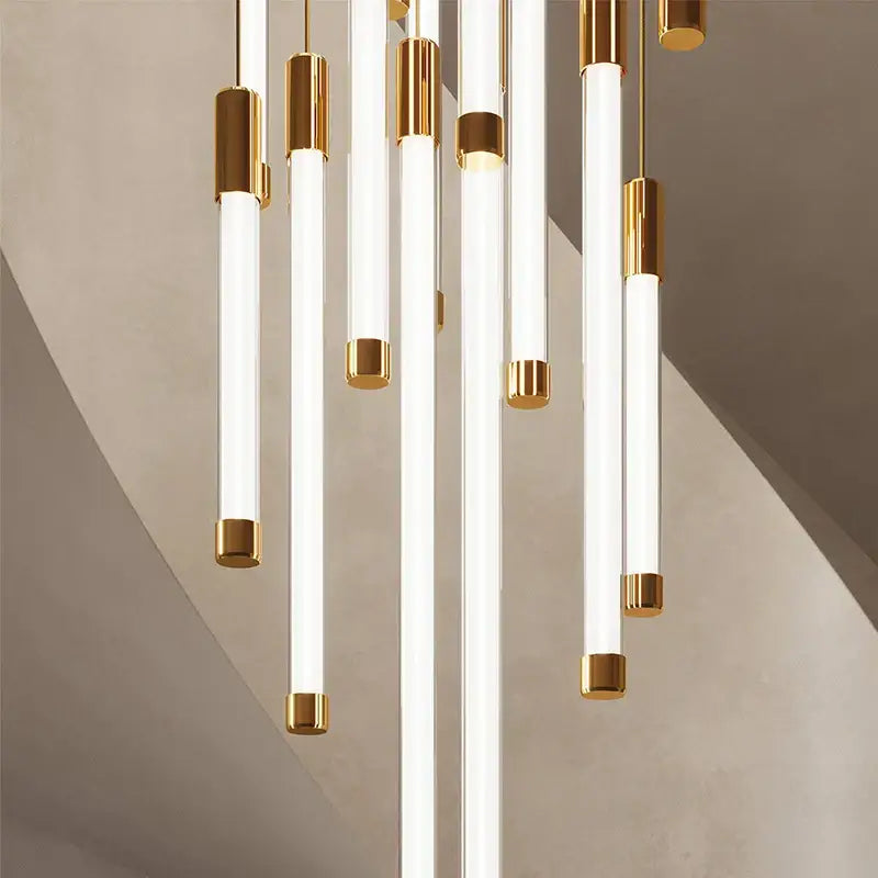 Modern decorbites™ led staircase chandeliers featuring white cylindrical tubes with polished gold accents for luxury lighting