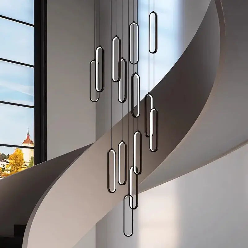 Modern minimalist decorbites led staircase pendant lights with brushed metallic finish in elegant cascade for living room