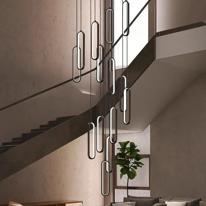 Modern minimalist decorbites led staircase pendant lights with sleek elongated oval shapes for living room lighting