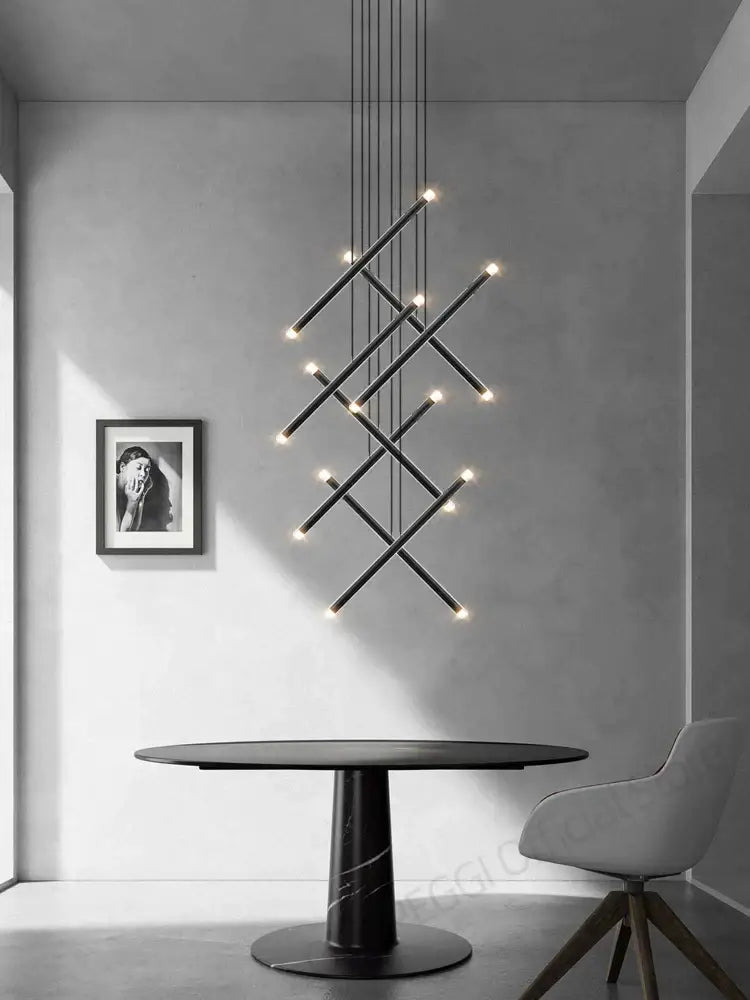 Black geometric decorbites led staircase pendant chandelier with intersecting rods and warm led lights for modern spaces