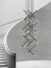 Black cylindrical decorbites led staircase pendant chandelier with intersecting rods and warm led lights for modern use