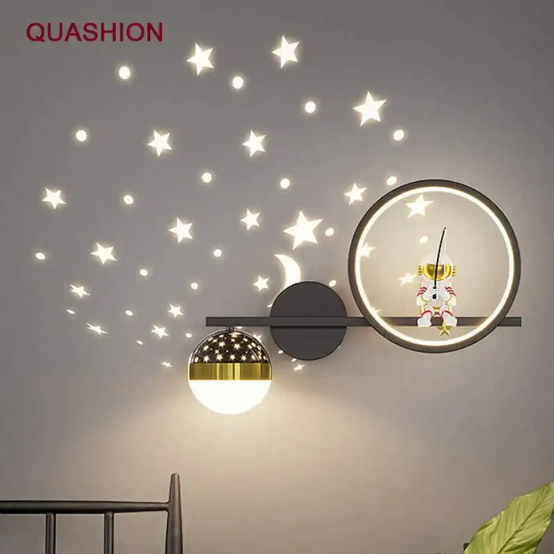 Modern decorbites led star wall light with gold and black accents and astronaut figure for children’s bedroom decor