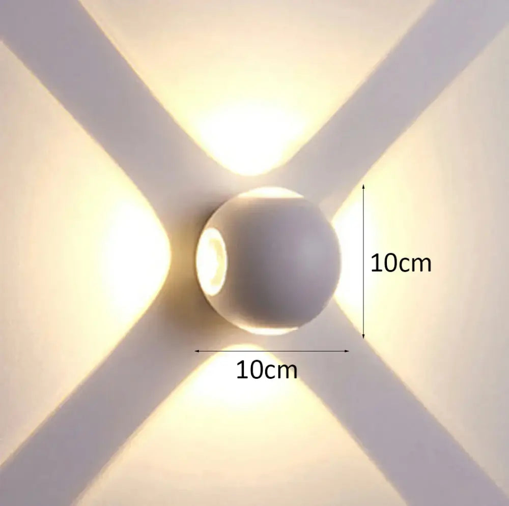 A sleek matte white spherical decorbites led starlight wall lamp emitting warm light for garden yard and home use