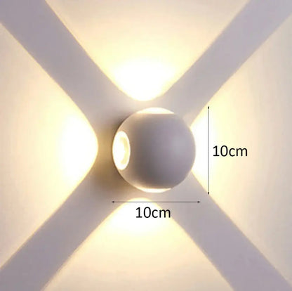 A sleek matte white spherical decorbites led starlight wall lamp emitting warm light for garden yard and home use