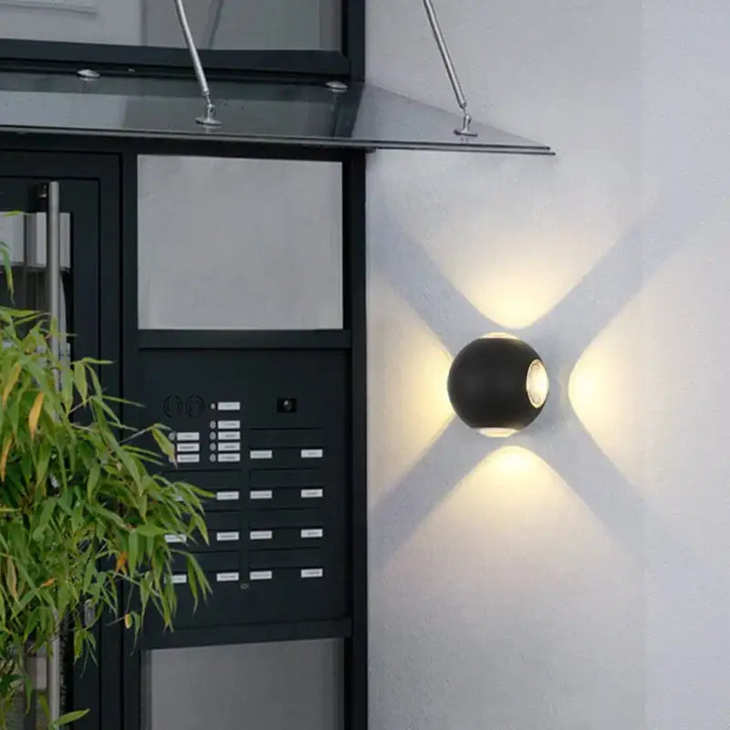 Black spherical outdoor wall lamp by decorbites led starlight emitting warm ambient light for garden and bar use