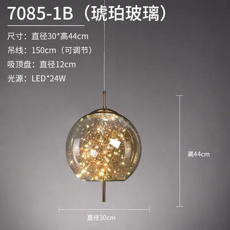 A spherical frosted glass pendant light with warm led fairy lights suspended by an adjustable brass chain by DecorBites LED Starry