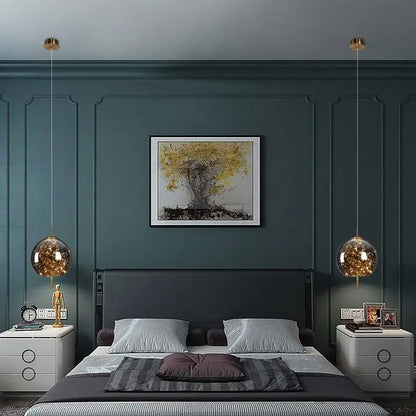 A pair of decorbites led starry sky pendant lights with golden fixtures and warm led bulbs for luxury living rooms