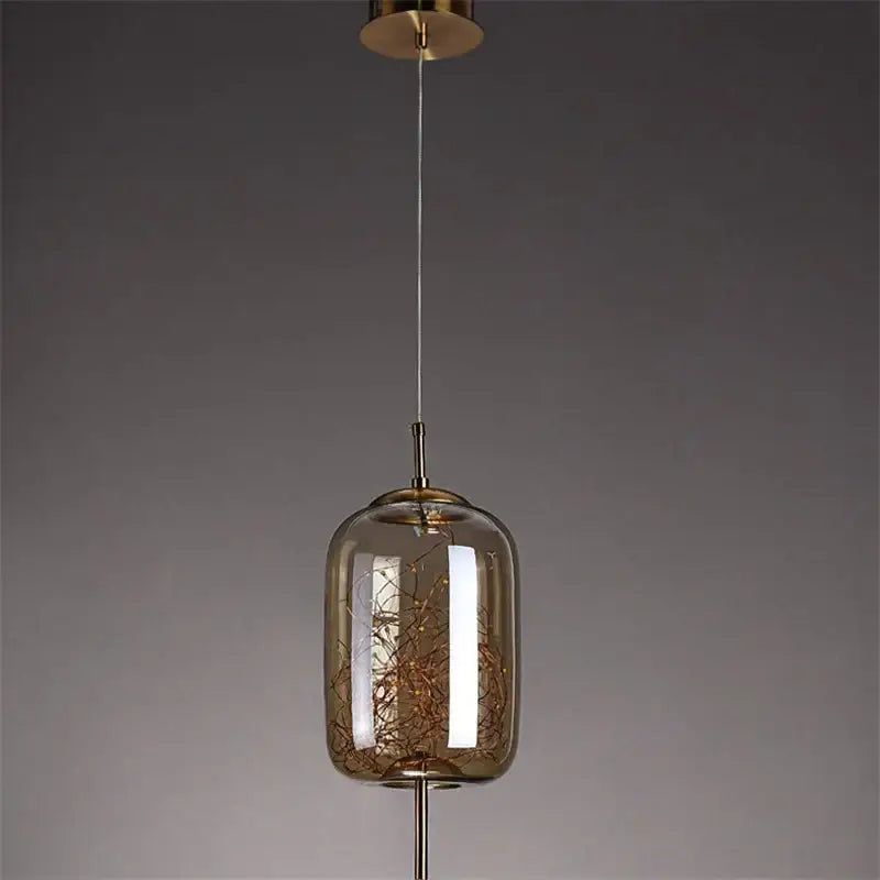 Modern decorbites led starry sky pendant light with smoked glass globe and golden wirework suspended by brass rod