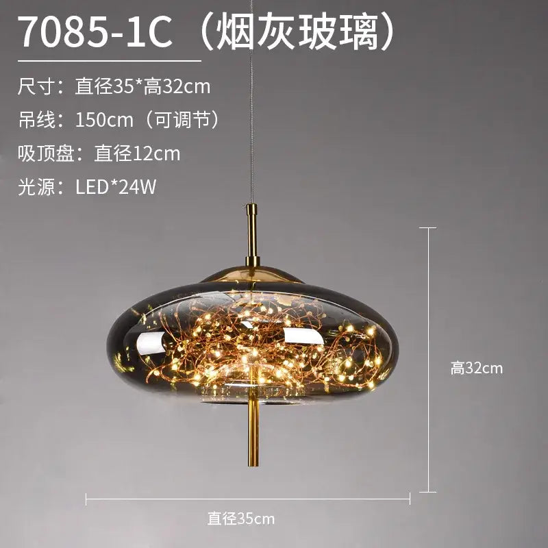 A sleek decorbites led starry pendant light with smoky glass dome and brass finish featuring warm led starry sky lights