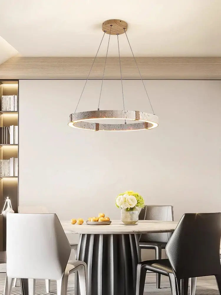 Modern circular led stone ring chandelier by decorbites with metallic textured ring and wooden ceiling mount for living room