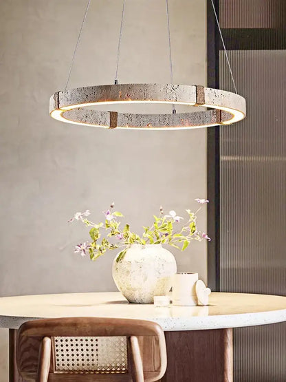 Modern circular DecorBites led stone ring chandelier with speckled concrete finish and warm LED illumination for living room