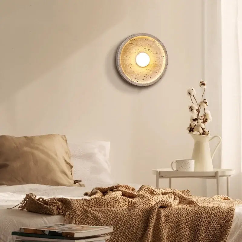 Circular decorbites led stone wall lamp with textured concrete finish and warm glowing center for modern home decor