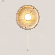 Circular concrete decorbites led stone wall lamp with warm textured interior and brass pull chain for modern home decor