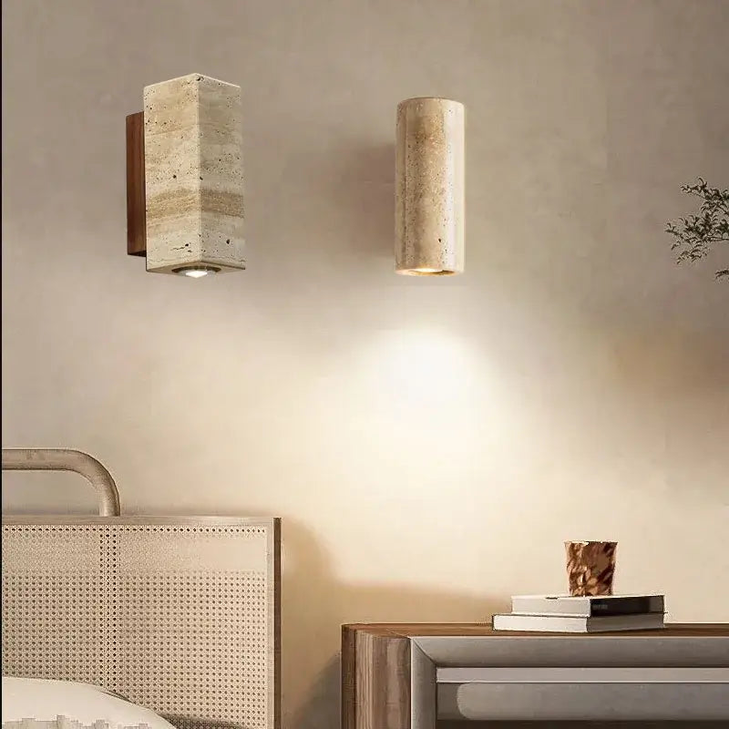 Two minimalist decorbites led stone wall sconces in beige textured stone with warm metal accents for retro home decor