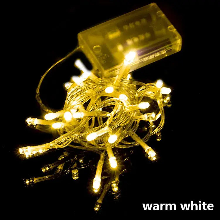 Warm white decorbites led string lights with clear plastic battery pack for holiday parties and weddings