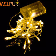 Warm white decorbites led string lights with small bulbs on thin wires and clear plastic battery pack for events