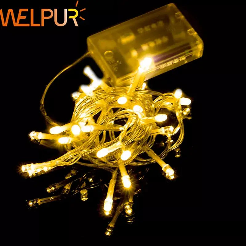 Warm white decorbites led string lights with small bulbs on thin wires and clear plastic battery pack for events