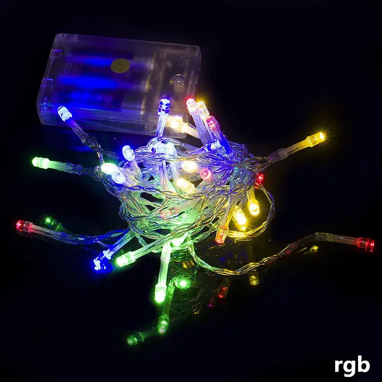 A tangled string of colorful decorbites led string lights with a clear plastic battery pack for holiday parties and weddings