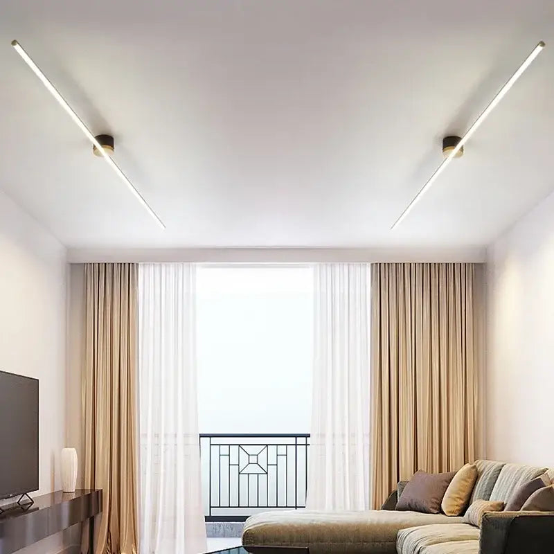 Two sleek gold-toned decorbites led strip ceiling lights emit soft white glow for modern indoor lighting