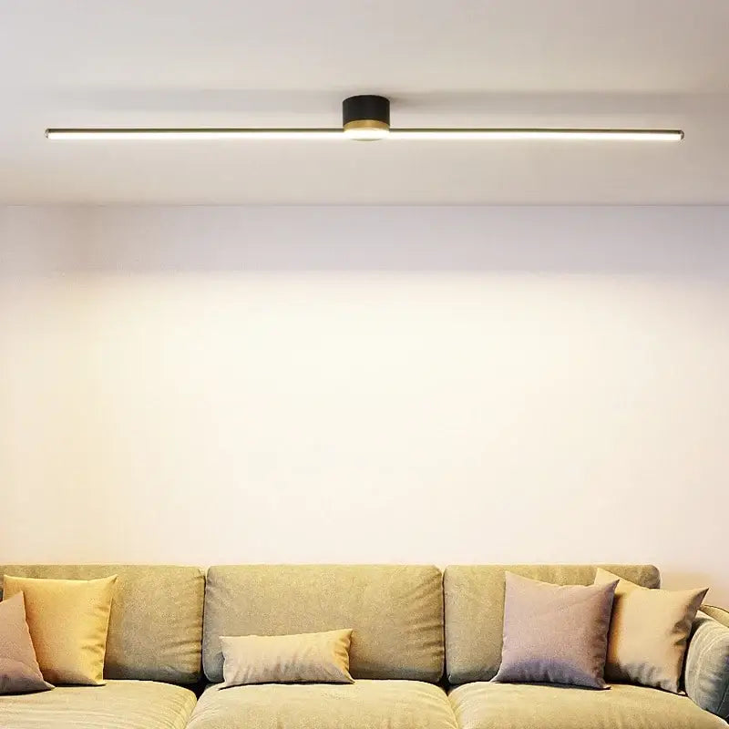 Modern black cylindrical DecorBites LED strip ceiling light with sleek linear design and warm white illumination