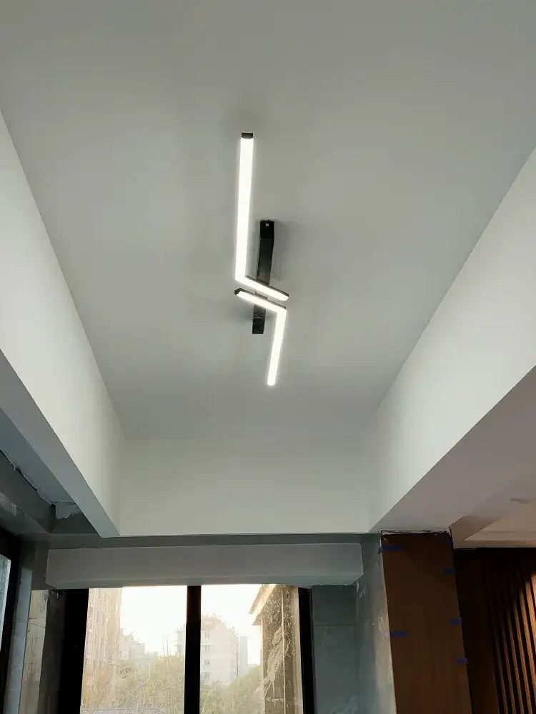Modern minimalist decorbites led strip ceiling lights with sleek black metal frame and intersecting white illuminated strips