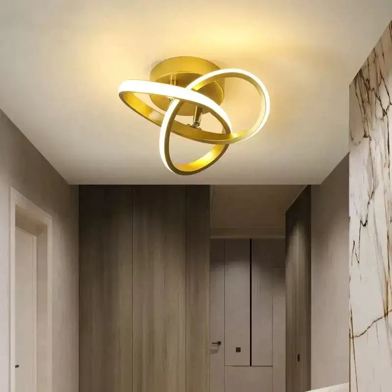Gold-colored decorbites led strip ceiling lights with intertwined circular rings and glowing white led illumination for home decor