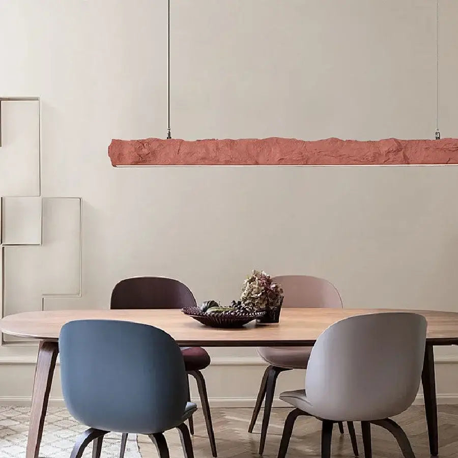 A long textured terracotta pendant light with organic surface from DecorBites led strip chandelier for dining room