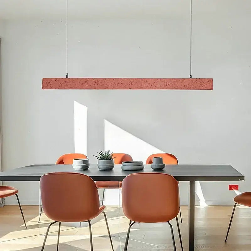A sleek rectangular terracotta pendant light with textured finish from DecorBites led strip chandelier for dining room