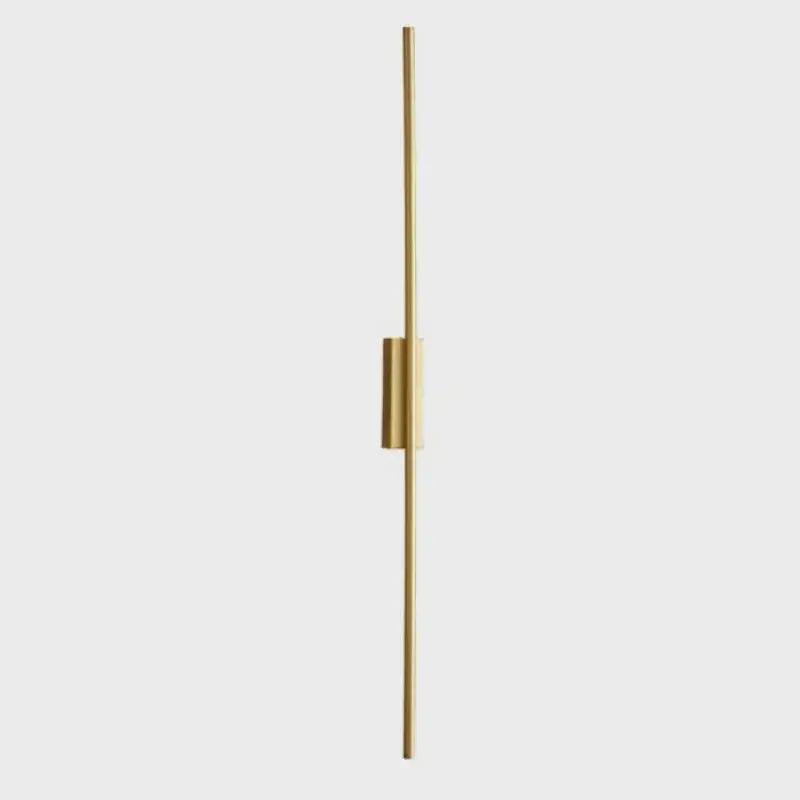 A sleek decorbites led strip copper wall lamp with gold-finished metal rod for living room and bedroom lighting