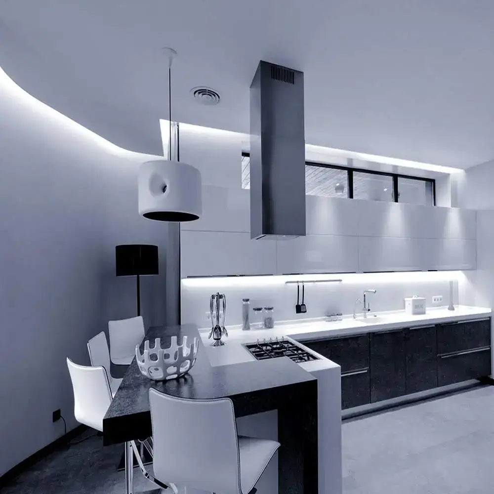 Modern minimalist kitchen with decorbites™ led strip light white warm white under-cabinet lighting and stainless steel hood