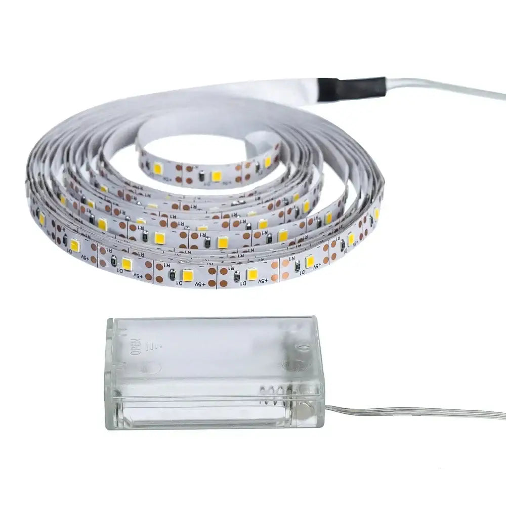 Coiled white decorbites™ led strip light smd2835 with yellow leds and a clear plastic battery pack flexible ribbon tape