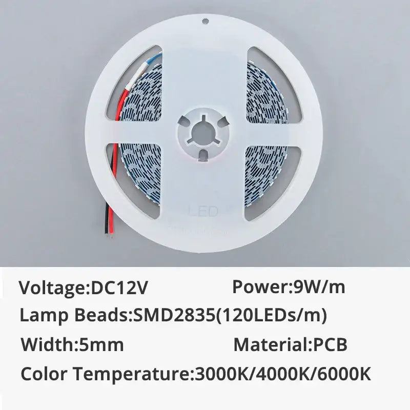 White circular spool holding flexible white led strip lights with smd2835 lamp beads and 120 leds per meter for decor