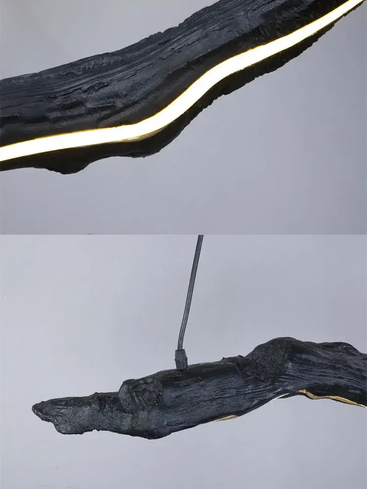 Organic black wooden dining room pendant with glowing gold decorbites led strip lights along curved edge