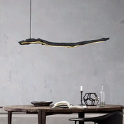 Organic black led strip lights dining room hanging pendant with a glowing yellow decorbites led strip underside