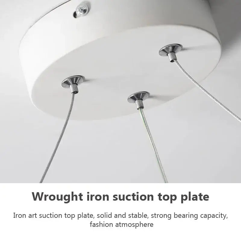 White circular wrought iron suction top plate with three silver cable attachments for decorbites led strip modern pendant light