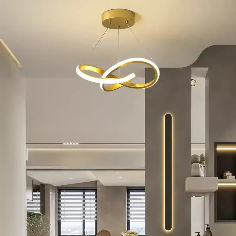 Gold-colored modern pendant light with two interlocking rings featuring decorbites led strip modern design for dining room