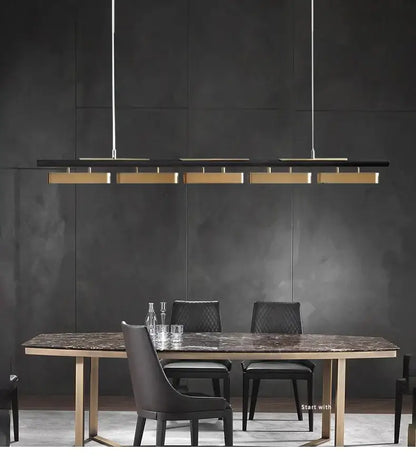 DecorBites™ modern minimalist strip pendant lights in black and gold with sleek metallic accents for dining areas