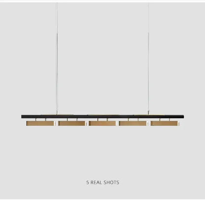 DecorBites™ modern minimalist strip pendant lights in black and brass with five horizontal led bars for dining rooms