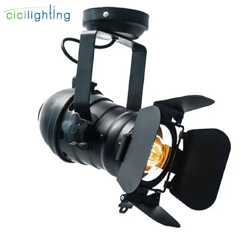 Black metal DecorBites LED surface mount spotlight with adjustable barn doors and filament bulb for stylish living room use