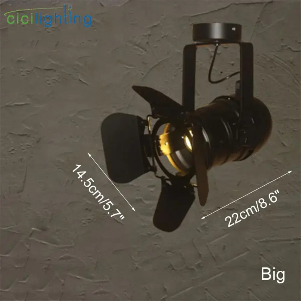 Black industrial-style decorbites led surface mount spotlight with vintage film projector design and brass accents