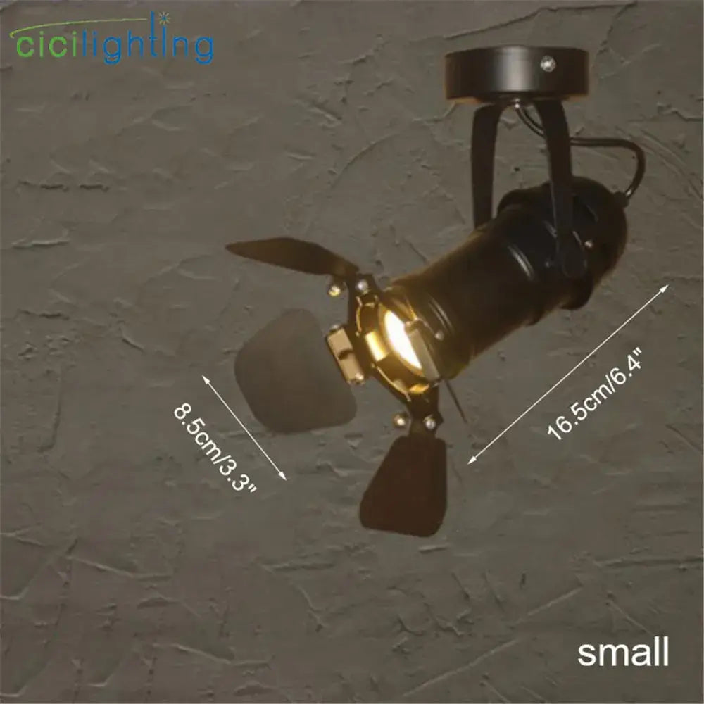 Black decorbites led surface mount spotlight with brass accents and adjustable wings for living room and retail lighting