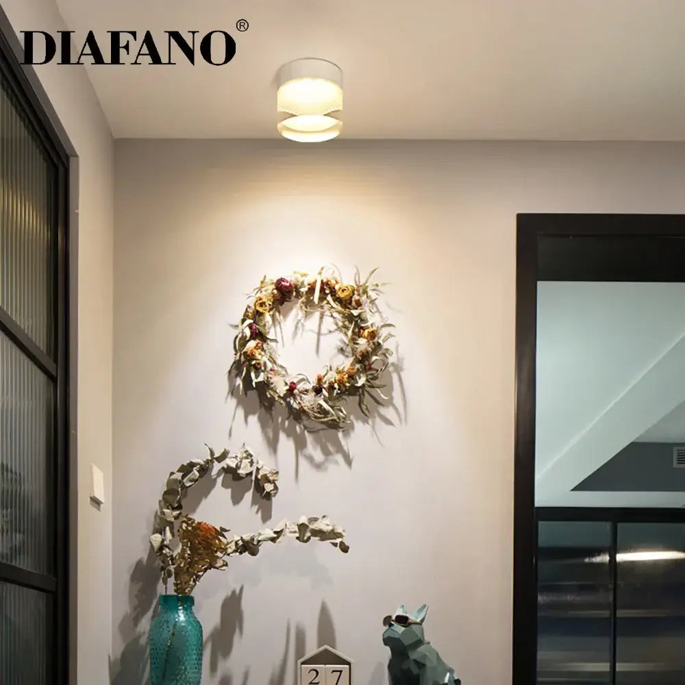 A modern cylindrical diafano decorbites led surface mounted spot light with warm glow for ceiling use
