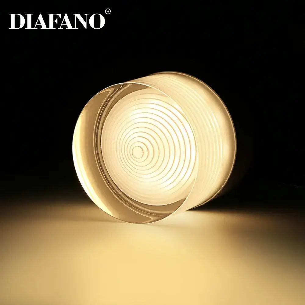 Diafano circular glass lamp with warm glowing light and concentric ridges in decorbites led surface mounted spot lights