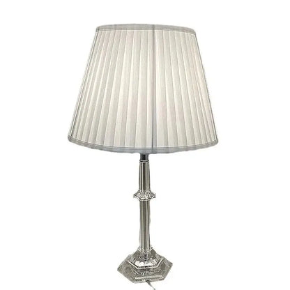 A sleek silver DecorBites led table lamp with a pleated off-white fabric shade and crystal-accented base for modern decor