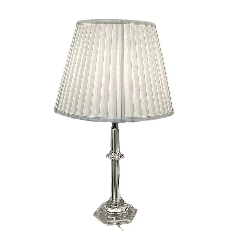 A sleek silver DecorBites led table lamp with a pleated off-white fabric shade and crystal-accented base for modern decor