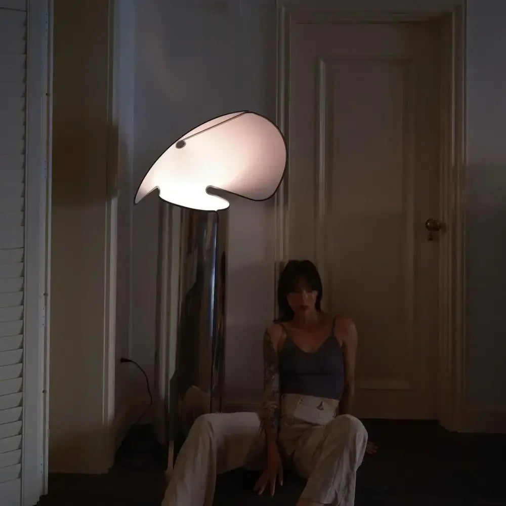 A decorbites led floor lamp with a sculpted white shade and chrome base for modern home and study lighting