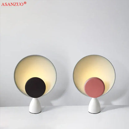 Modern asanzuo led table lamp with sleek white base and circular glowing shade featuring black or pink disc for study desk lighting