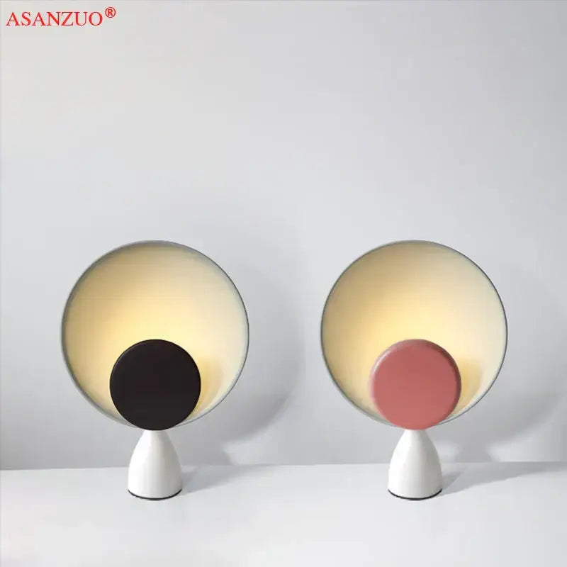 Modern asanzuo led table lamp with sleek white base and circular glowing shade featuring black or pink disc for study desk lighting