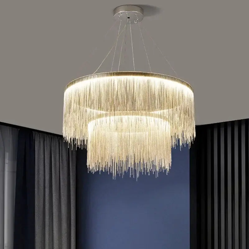A modern decorbites led tassel chandelier with cascading golden crystal strands and a sleek metallic frame for art decor lighting
