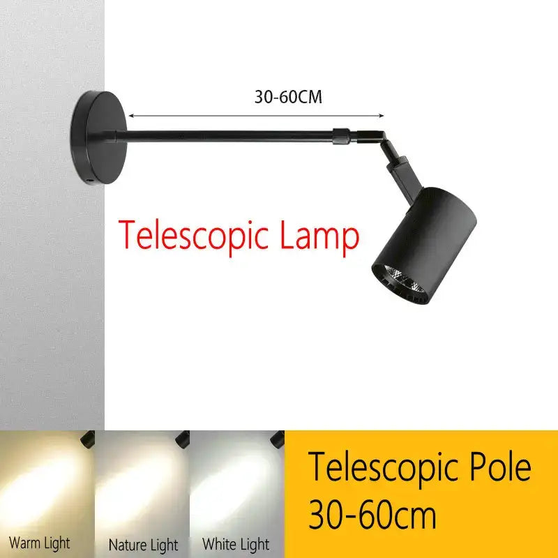 Black aluminium decorbites™ telescopic wall lamp with adjustable pole and cylindrical head for gallery lighting